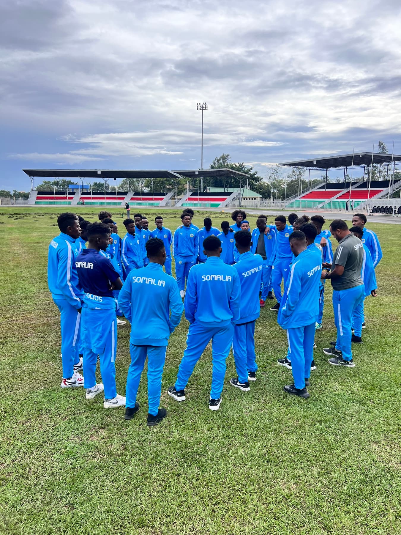 Somalia players gathered in a team huddle
